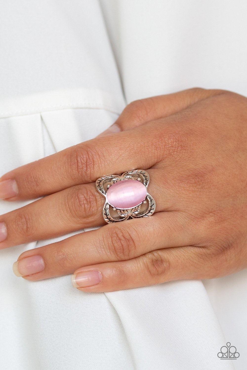 Paparazzi Accessories Go For Glow - Pink A glowing pink cat's eye stone is pressed into the center of a shimmery silver frame etched in leafy details for a whimsical look. Features a stretchy band for a flexible fit. Jewelry