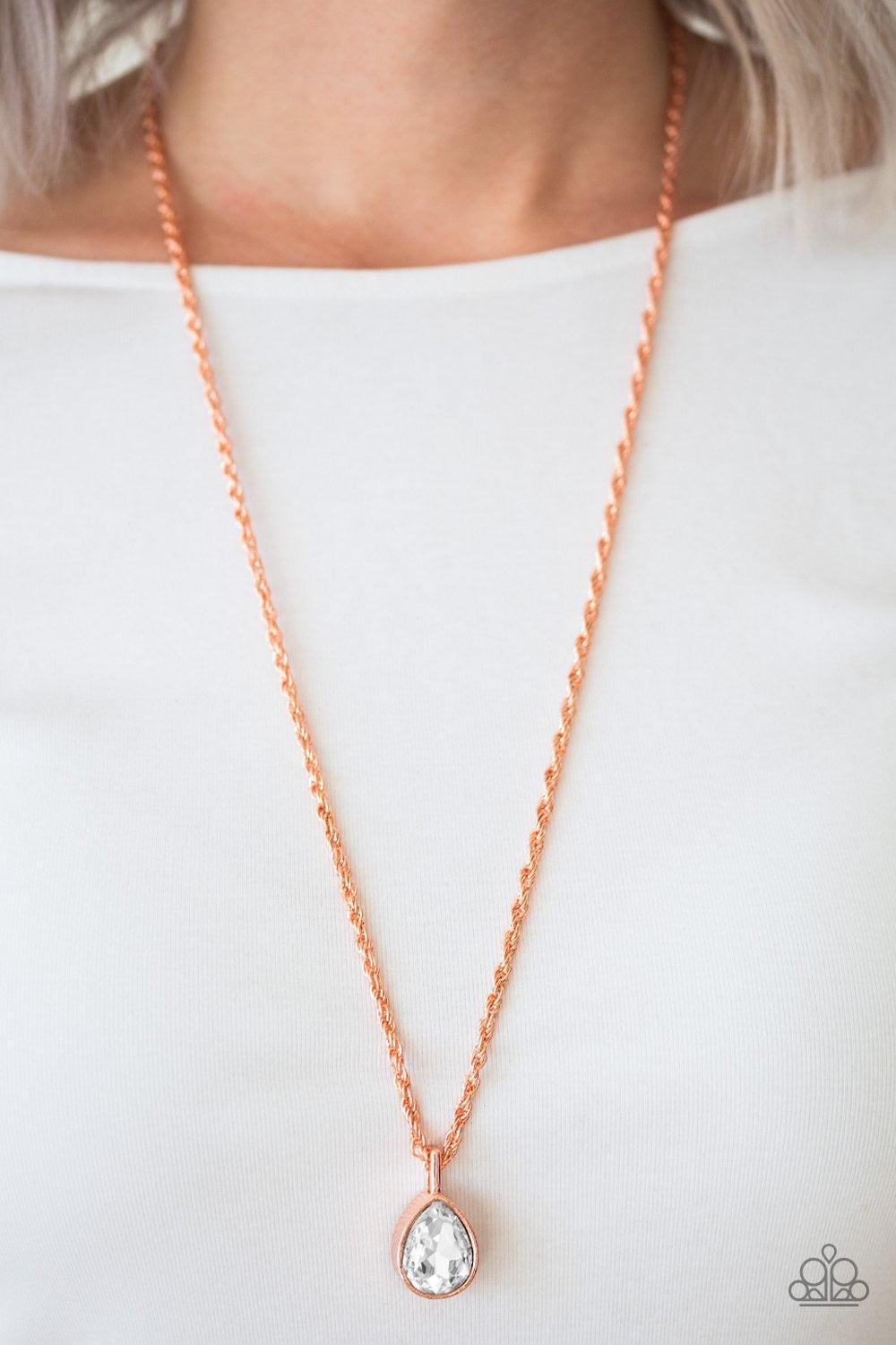 Paparazzi Accessories Million Dollar Drop - Copper A white teardrop gem is pressed into a sleek copper frame, creating a bold 3-dimensional pendant below the collar. Features an adjustable clasp closure. Sold as one individual necklace. Includes one pair