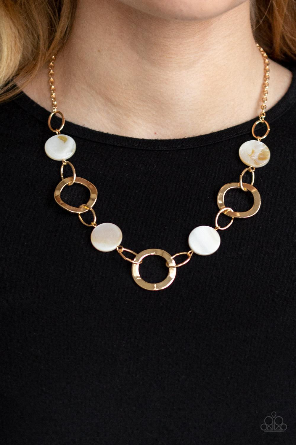 Paparazzi Accessories Bermuda Bliss - White White shell-like discs link with asymmetrical gold hoops below the collar for a colorfully seasonal look. Features an adjustable clasp closure. Jewelry