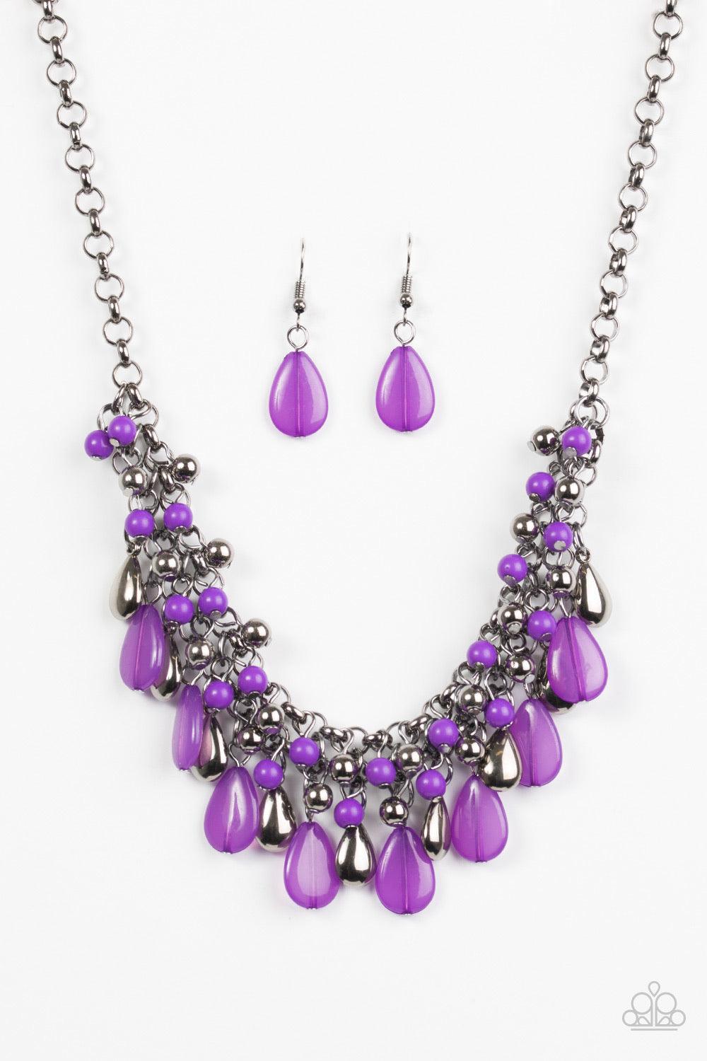 Paparazzi Accessories Diva Attitude - Purple Glistening gunmetal and vivacious purple teardrops drip from the bottom of interlocking gunmetal chains. Matching gunmetal and purple beads trickle down the rows of chain, creating a bold fringe below the colla