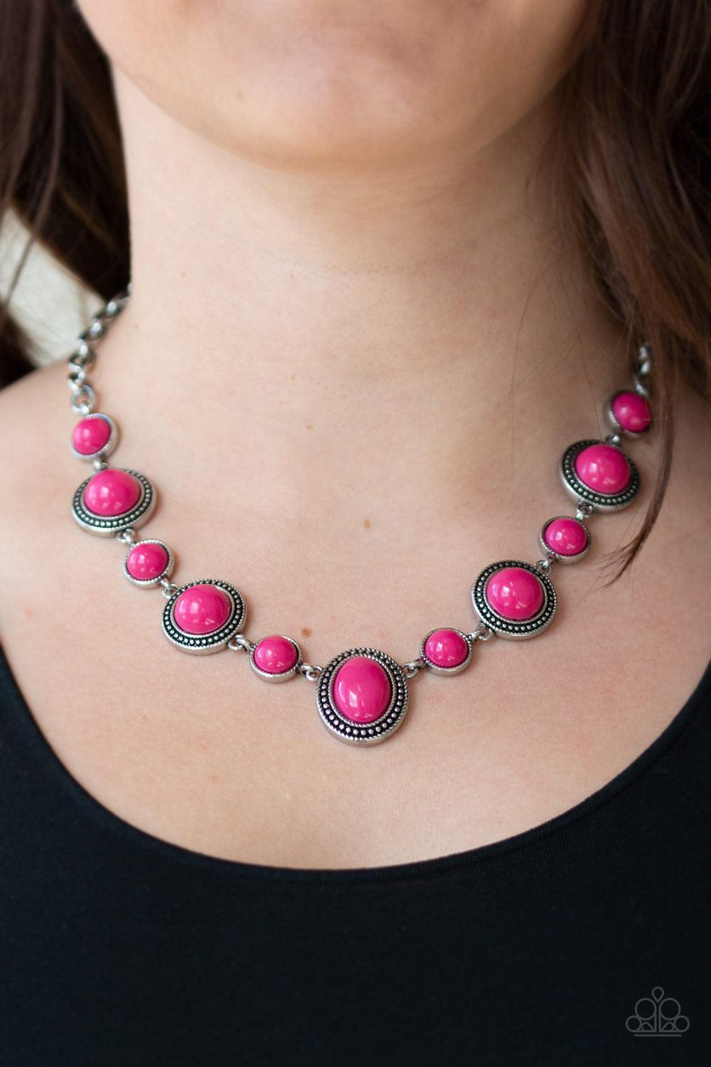 Paparazzi Accessories Voyager Vibes ~Pink Featuring smooth and studded silver frames, vivacious pink beads link below the collar in a seasonal fashion. Features an adjustable clasp closure. Sold as one individual necklace. Includes one pair of matching ea