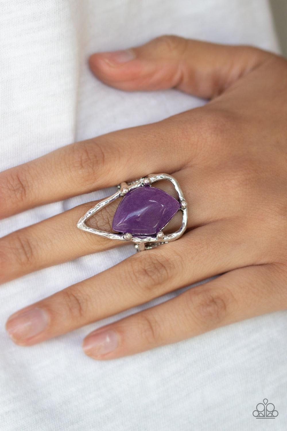 Paparazzi Accessories Get The Point - Purple An abstract purple stone is nestled inside a hammered silver triangle, creating an artisan inspired frame atop the finger. Features a stretchy band for a flexible fit. Jewelry