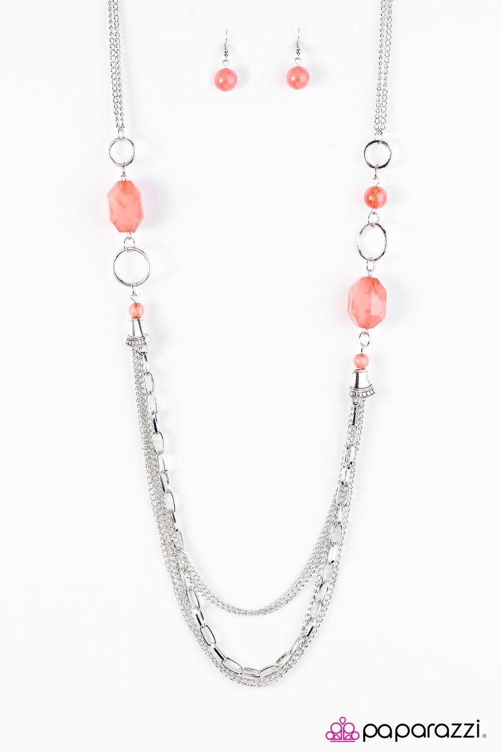 Paparazzi Accessories Have An Ice Day - Orange Featuring smooth and glassy faceted finishes, smoky orange beads join silver hoops along a shimmery silver chain, creating an icy palette. Two silver accents give way to trestles of mixed chain, adding an ind