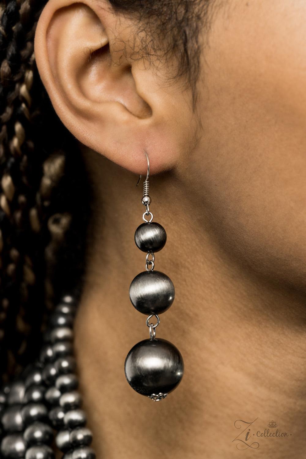 Paparazzi Accessories Instinct 💗ZiCollection $25💗 Strung between two silver fittings, row after row of hypnotizing gunmetal cat's eye beads cascade down the chest. The mesmerizing strands vary in size and pattern, creating haphazard layers of spellbindi