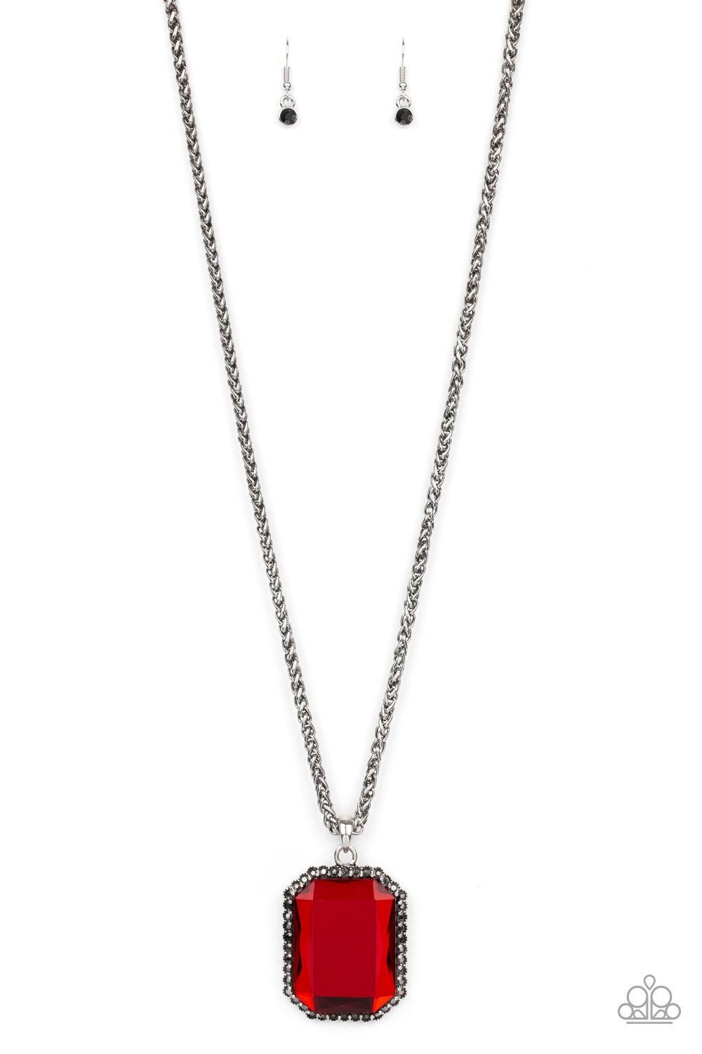 Paparazzi Accessories Let Your HEIR Down ~Red Bordered in dainty hematite rhinestones, an oversized faceted red emerald style gem swings from the bottom of an antiqued silver wheat chain for a blinding look. Features an adjustable clasp closure.