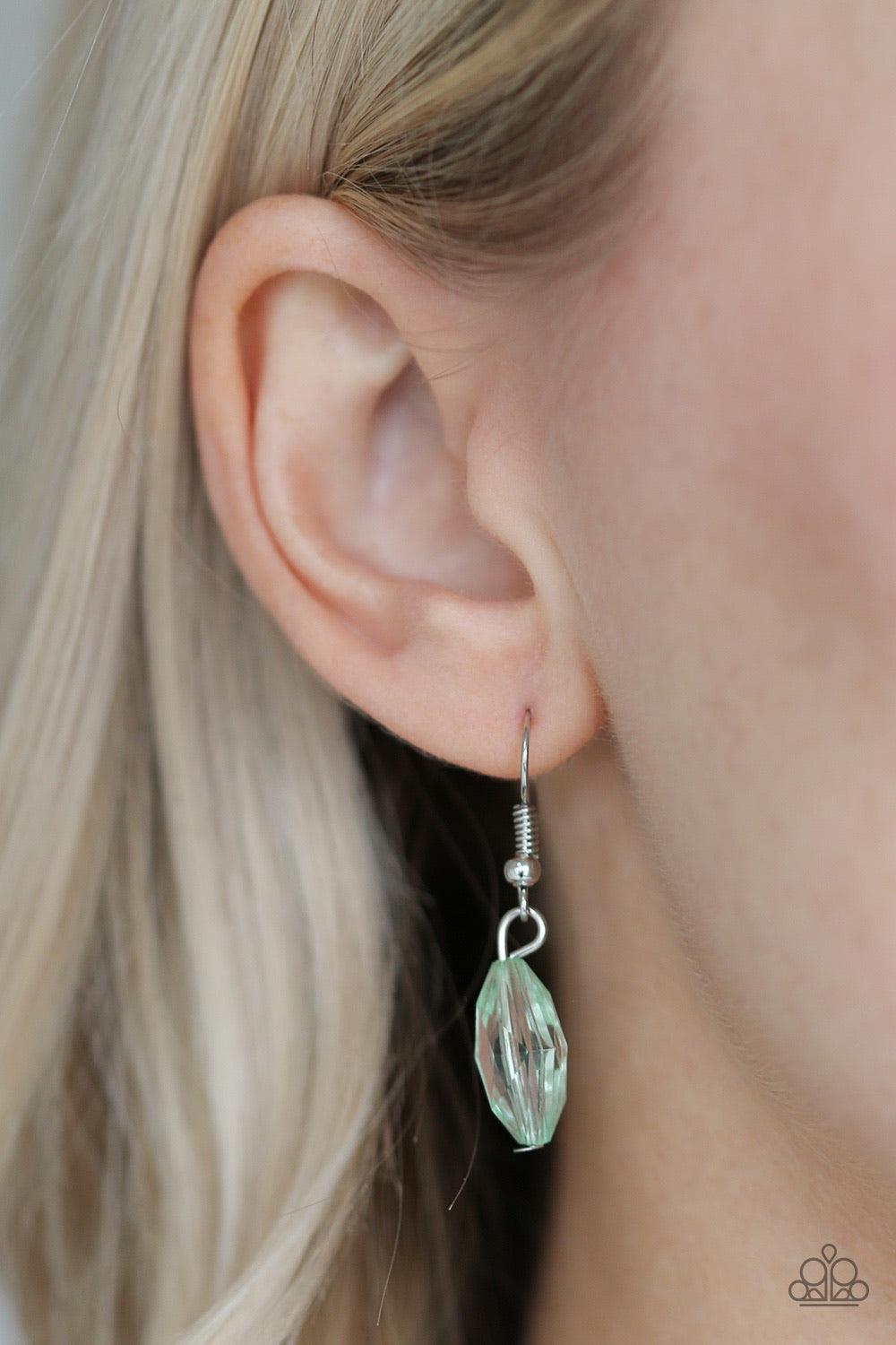 Paparazzi Accessories Glow And Steady Wins The Race - Green A gorgeous collection of glassy and cloudy green crystal-like beads trickle along a shimmery silver chain down the chest in a whimsical fashion. Features an adjustable clasp closure. Jewelry