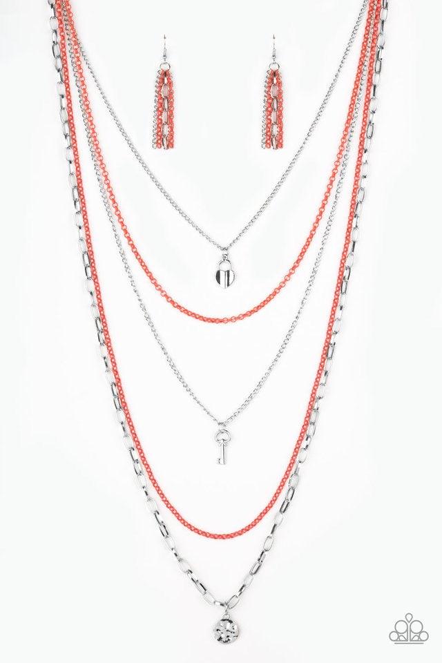 Paparazzi Accessories Right On Key - Orange Layers of orange and silver chain fall together to create the illusion of five separate necklaces. Each silver chain is adorned with a small silver charm, including a heart and a key. Features an adjustable clas