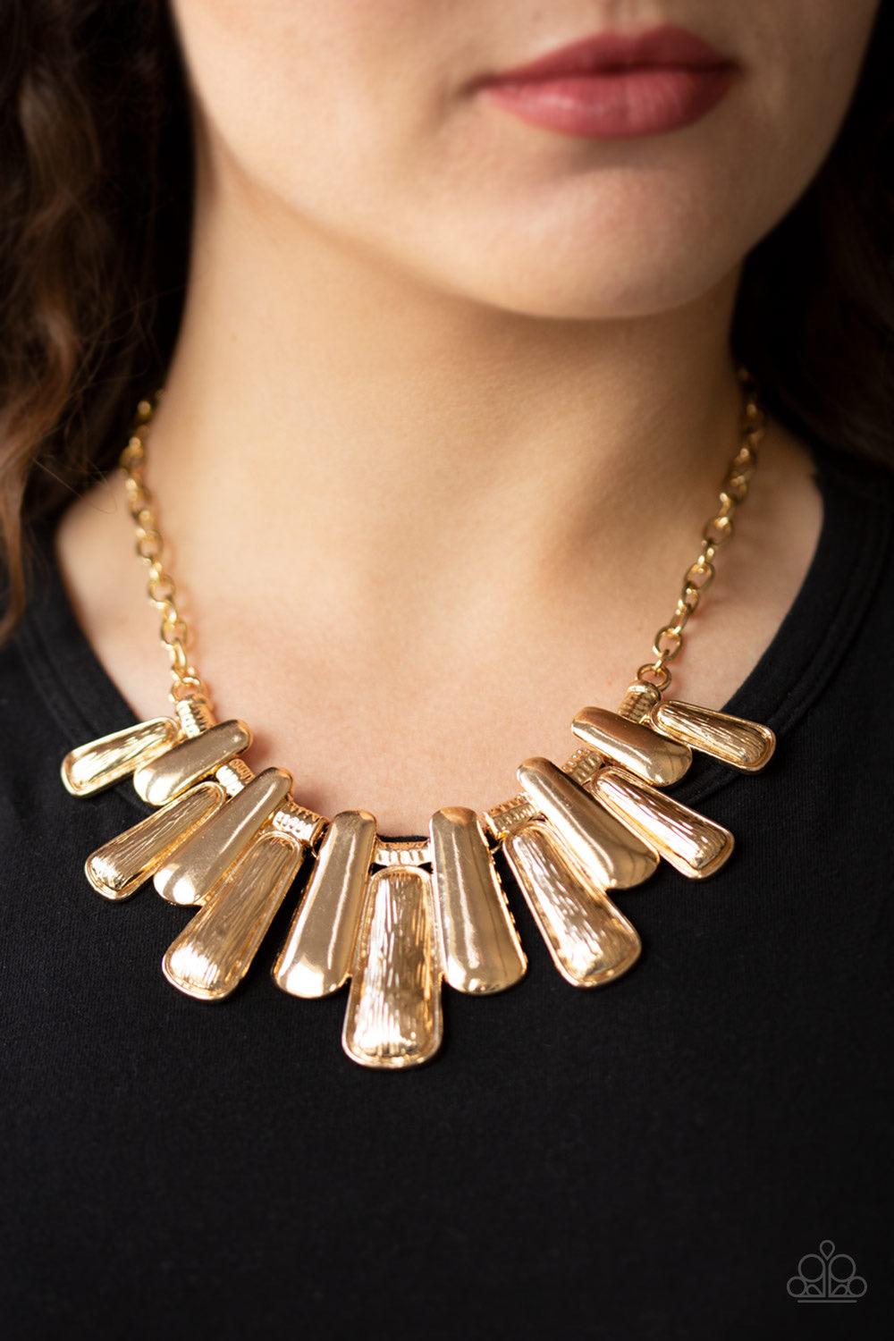Paparazzi Accessories MANE Up - Gold Featuring smooth and etched finishes, a collection of glistening gold plates link below the collar, creating a blinding fringe. Features an adjustable clasp closure. Jewelry