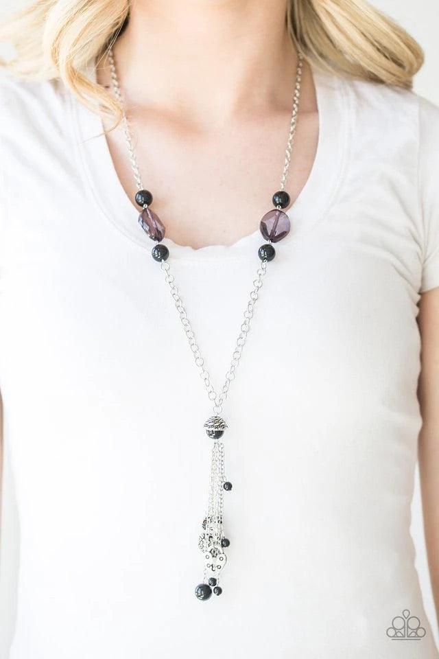 Paparazzi Accessories Heart-Stopping Harmony - Black Glassy and shiny black beading trickles down the sides of an elegantly elongated silver chain. A collection of silver heart charms and black beads swing from the bottom of the chain, creating a whimsica