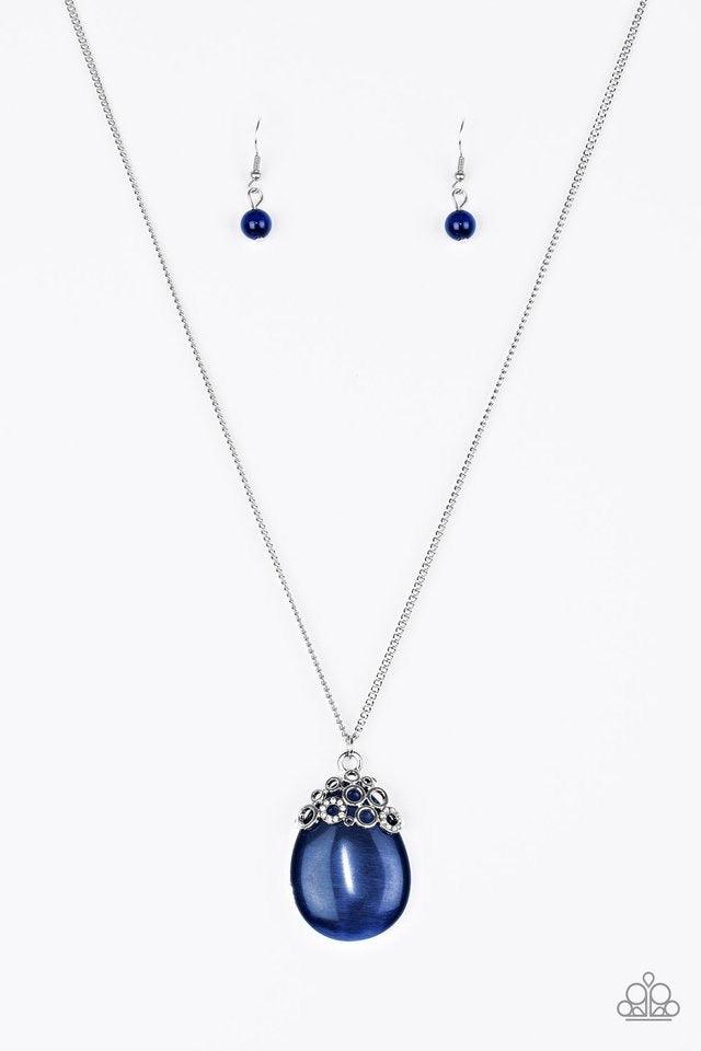 Paparazzi Accessories Nightcap And Gown - Blue Sporadically dotted in glittery white rhinestones, dainty silver circles join around the top of a glassy blue teardrop moonstone. The bubbly pendant swings from the bottom of a lengthened silver chain for a w