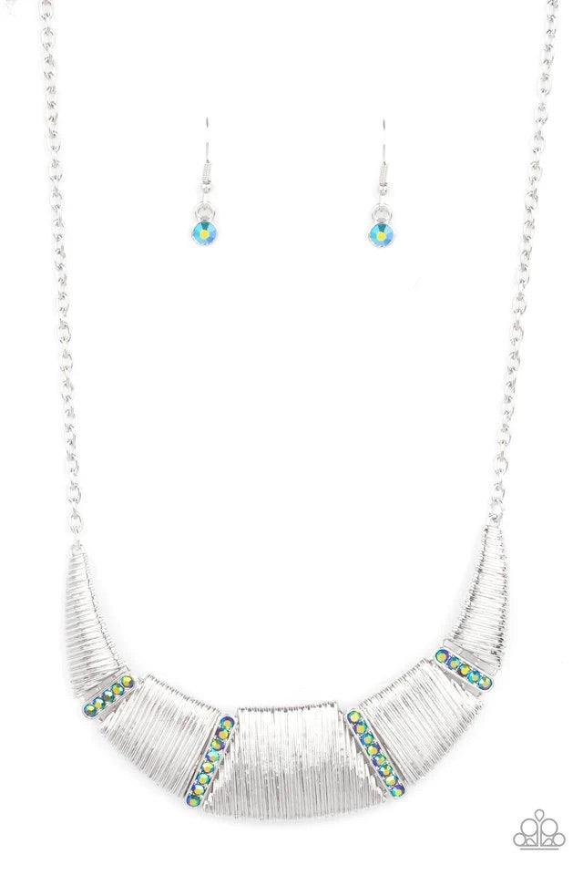 Paparazzi Accessories Going Through Phases - Multi Embossed in linear textures, trapezoidal and triangular silver plates delicately link with dainty iridescent metallic rhinestone encrusted frames, creating a dramatic half moon below the collar. Features