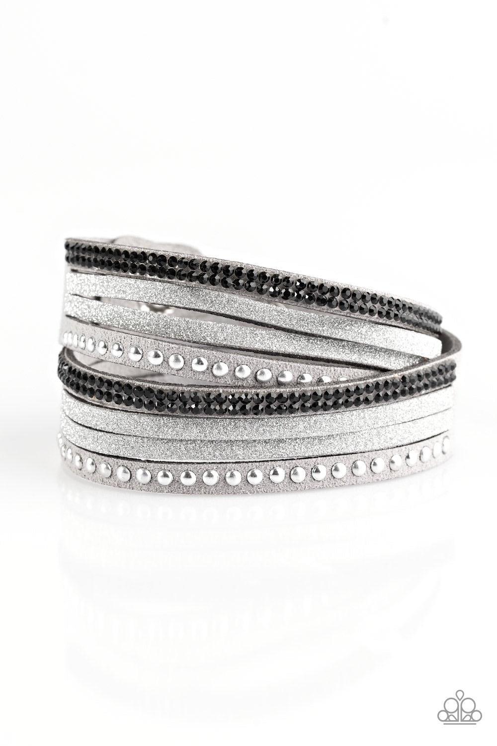 Paparazzi Accessories Once Upon A SHOWTIME - Silver Strands of glistening silver studs, glassy black rhinestones, and gray suede dusted in glitter wrap around the wrist, creating mismatched shimmer. The elongated band allows for a trendy double wrap desig