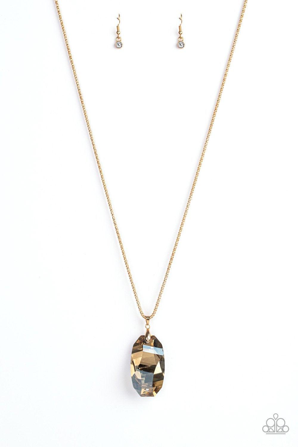 Paparazzi Accessories Gemstone Grandeur - Gold Featuring a raw cut and metallic backing, a golden gem swings from the bottom of an elongated gold popcorn chain. Dotted with a dainty white rhinestone, the faceted gem catches and refracts the light for a bl