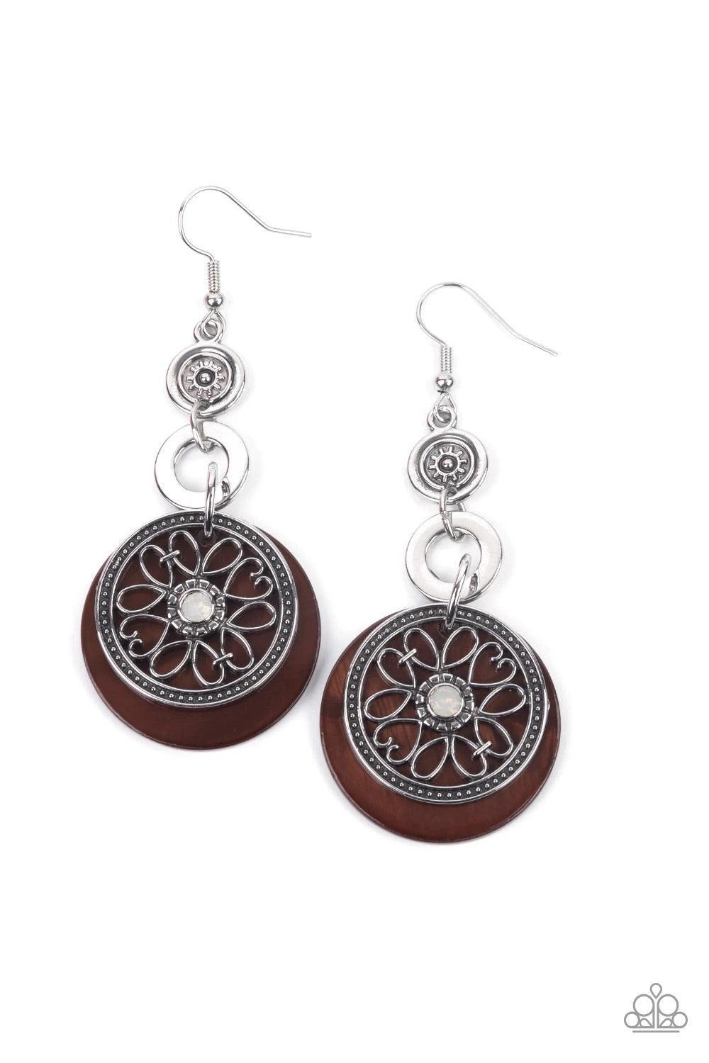 Paparazzi Accessories Royal Marina - Brown Reminiscent of an eclipse, an airy silver ring radiating with ornate petals, sways in front of a brown shell-like disc. Silver rings in graduating sizes cascade from the top for a whimsically nautical look. Earri