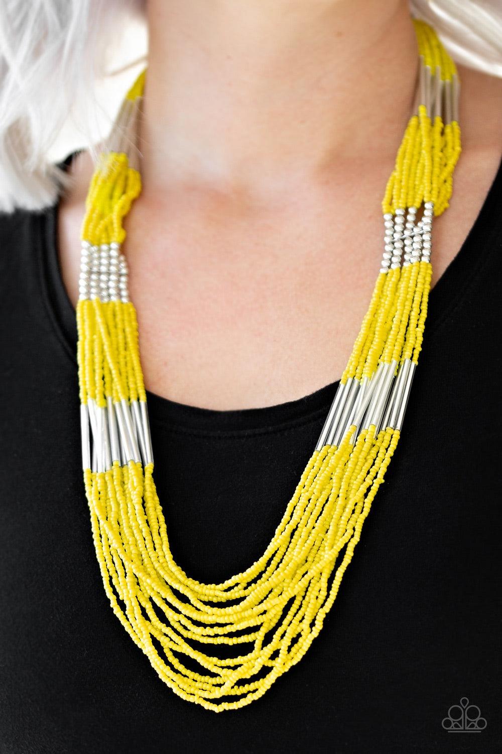 Paparazzi Accessories Let It BEAD - Yellow Countless strands of yellow seed beads drape across the chest in a layered cascade. Accented with classic silver beading, glassy cylindrical beading is added to the display for a radiant finish. Features an adjus