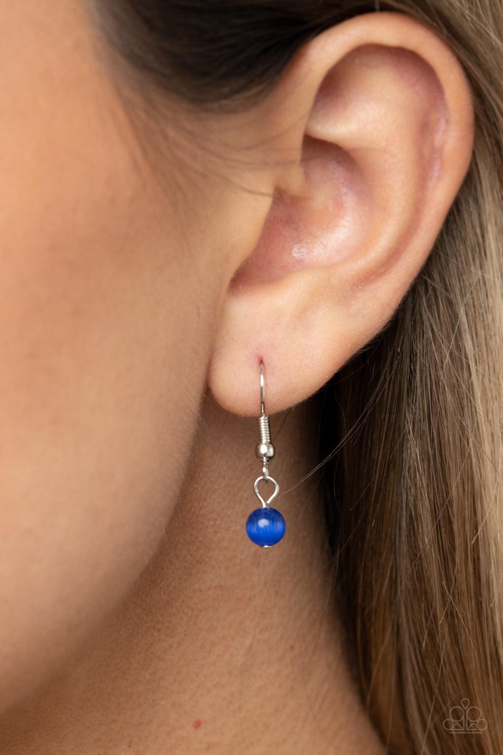 Paparazzi Accessories One Can Only Gleam - Blue Gradually increasing in size, a dainty collection of glowing blue cat's eye oval stones delicately link below the collar for a whimsical pop of color. Features an adjustable clasp closure. Sold as one indivi