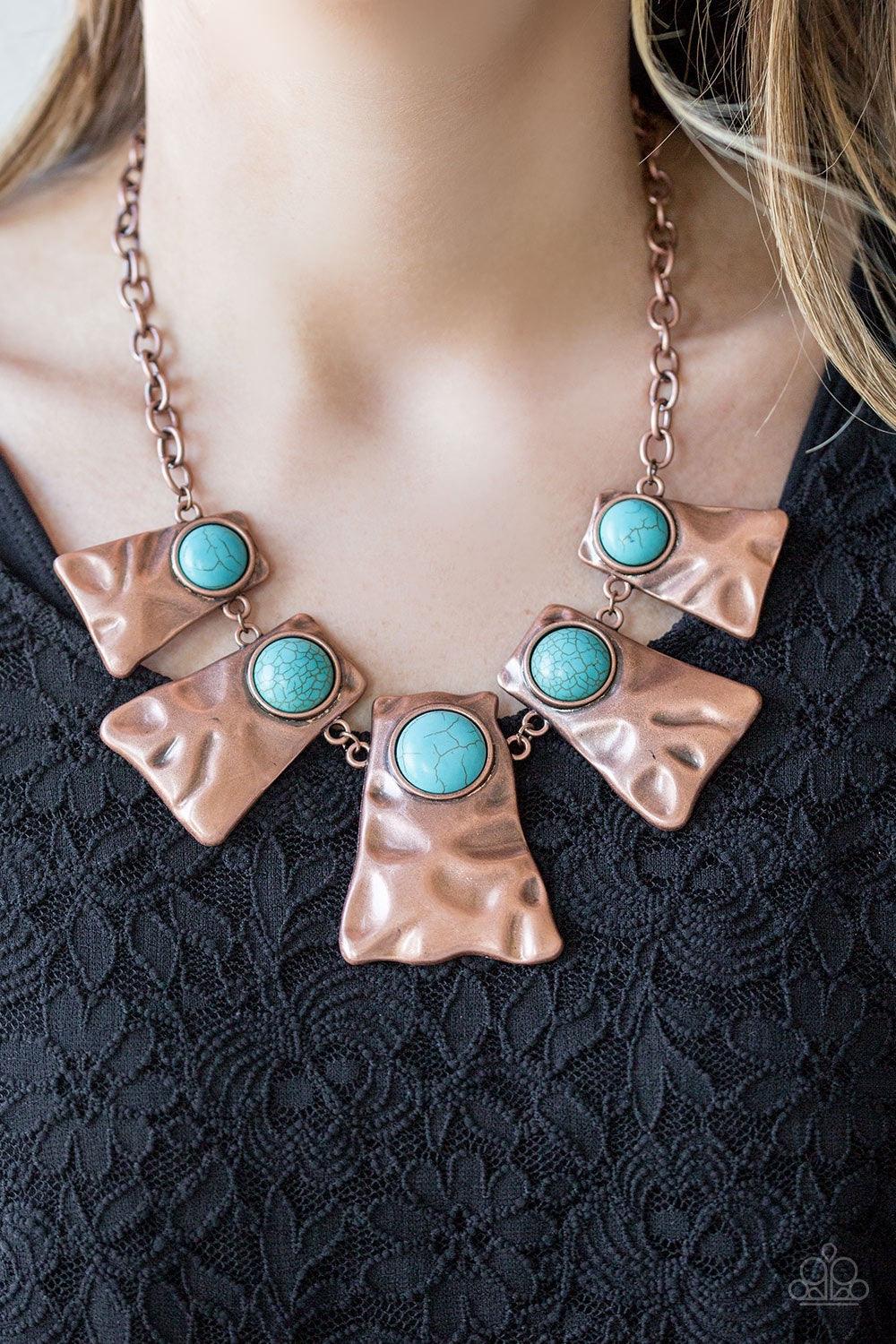 Paparazzi Accessories Cougar - Copper Rippling with hammered details, flared copper frames join below the collar, creating a fierce fringe. Refreshing turquoise stones are pressed into the tops of the frames for a colorful finish. Features an adjustable c