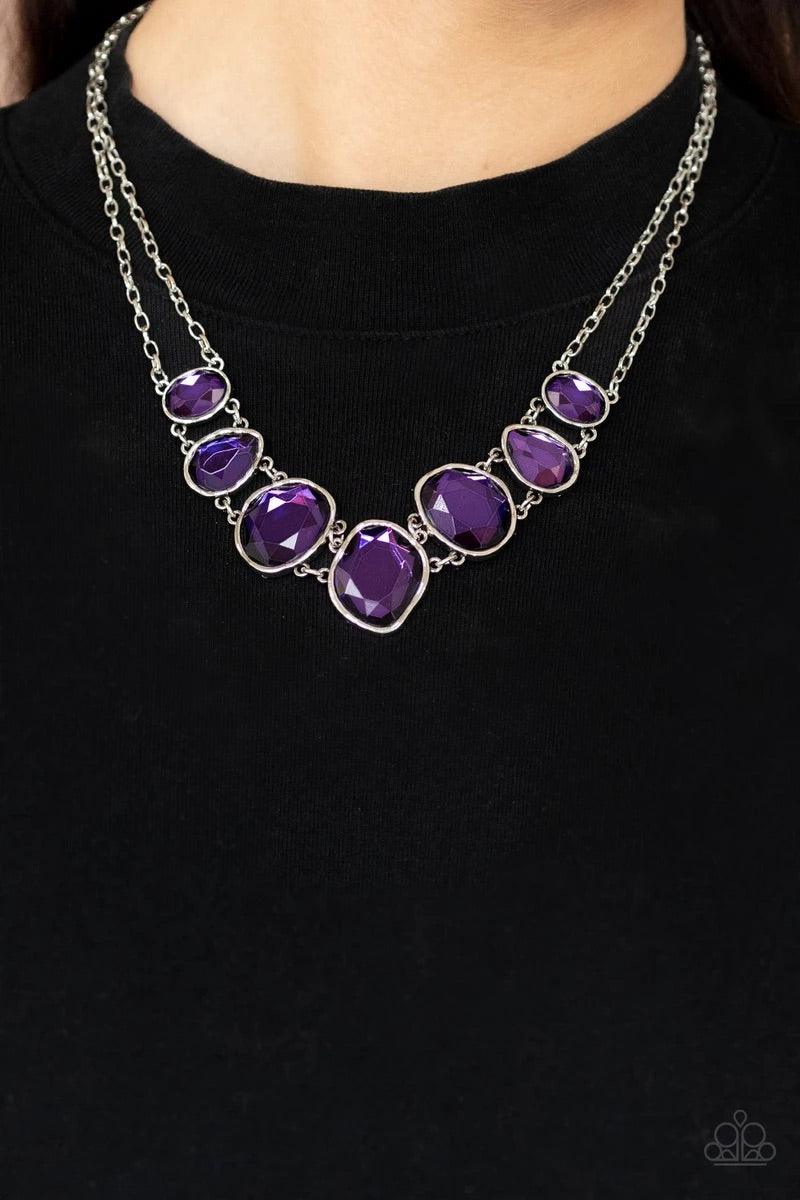 Paparazzi Accessories Absolute Admiration - Purple Encased in hammered asymmetrical silver frames, an imperfect collection of faceted purple gems are suspended from two shimmery silver chains as they double-link below the collar for a dramatic effect. Fea