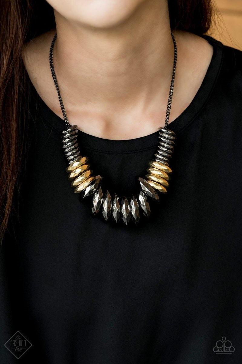 Paparazzi Accessories Haute Hardware - Multi Gradually increasing in size, a collision of faceted gunmetal and gold rings slides along a classic gunmetal chain below the collar, creating a bold industrial statement piece. Features an adjustable clasp clos