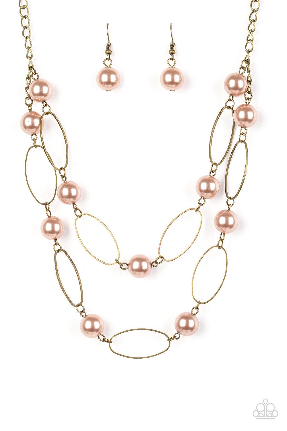 Paparazzi Accessories Best of Both POSH-ible Worlds - Brass Two rows of pearly brown beads and brass oval frames alternate below the collar, creating luminescent layers. Features an adjustable clasp closure. Sold as one individual necklace. Includes one p
