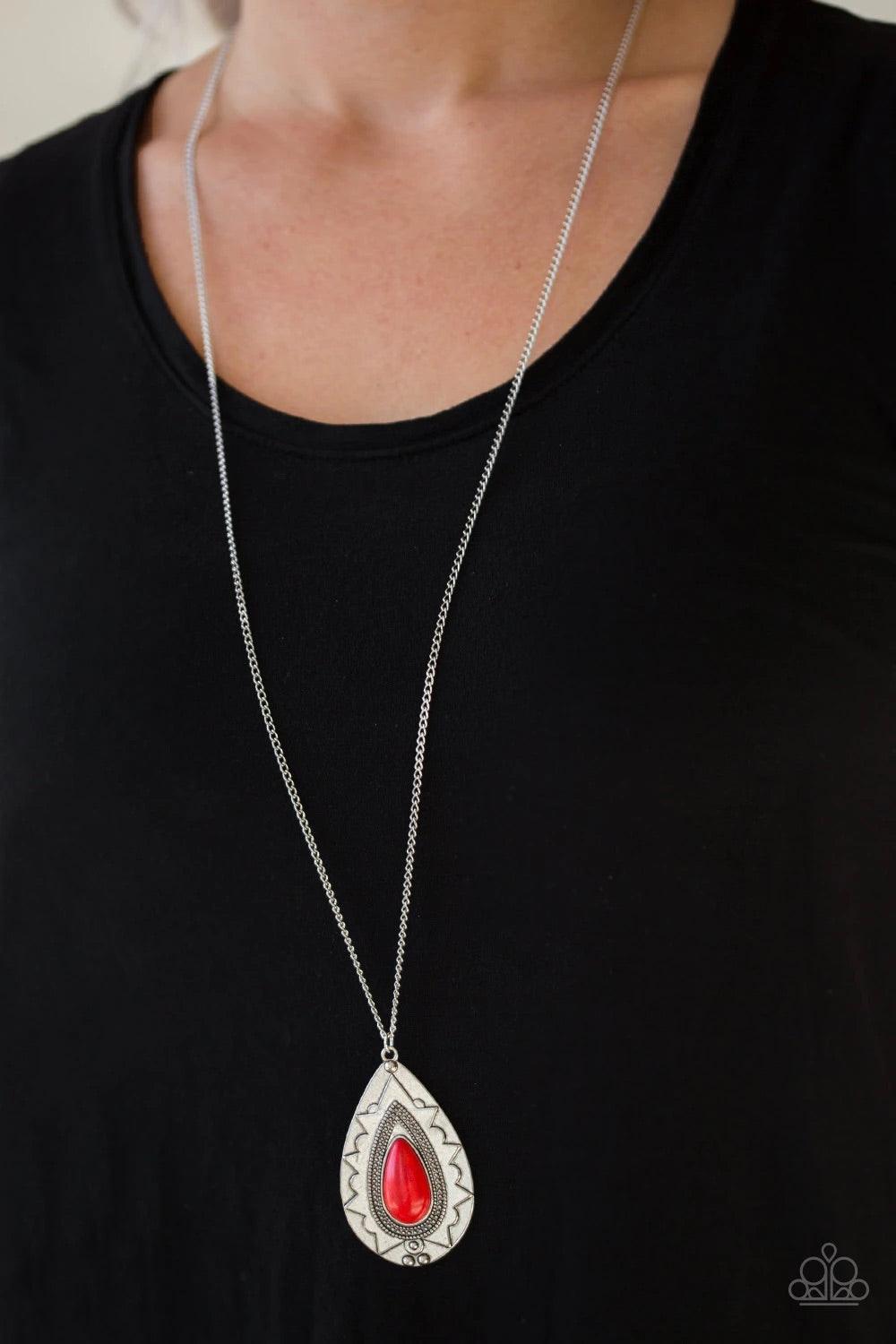 Paparazzi Accessories Sedona Solistice - Red Chiseled into a tranquil teardrop, a fiery red stone is pressed into an ornate silver frame. The whimsical pendant swings from the bottom of a lengthened silver chain for a seasonal look. Features an adjustable