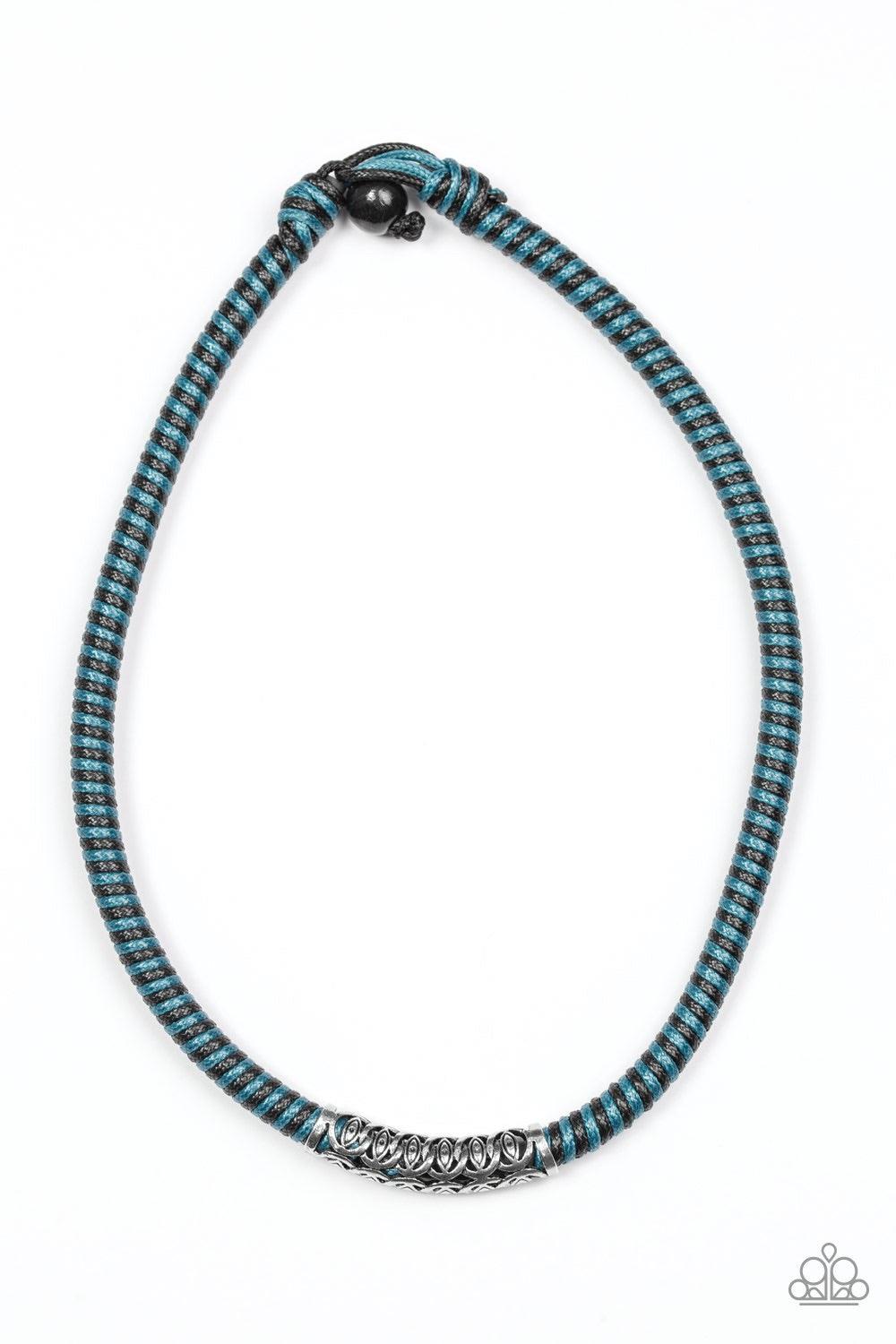 Paparazzi Accessories The Mainland - Blue Blue and black cording knots around a leather cord, creating a colorful urban piece below the collar. An ornate silver bead slides along the colorful strand, creating a bold centerpiece. Features a button loop clo