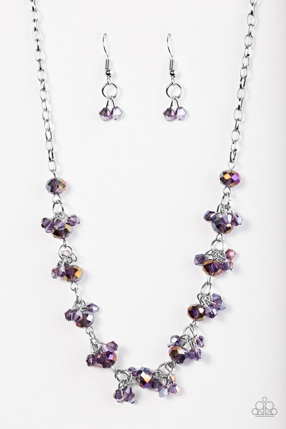 Paparazzi Accessories Leading STARLIGHT - Purple Glassy and faceted purple crystal beading trickles along a silver chain, creating a dramatic fringe below the collar. Featuring elegant pear-shaped cuts, iridescent crystals cluster atop the glassy gems for