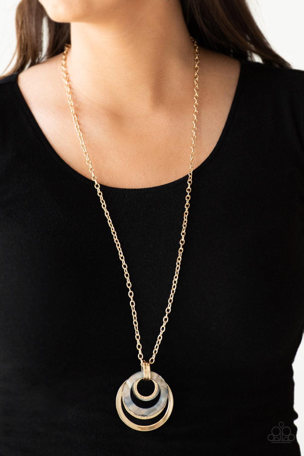 Paparazzi Accessories Coast Coasting - Gold Brushed in an iridescent finish, shell-like hoops join mismatched gold hoops at the bottom of an elongated gold chain for a whimsical look. Features an adjustable clasp closure. Jewelry