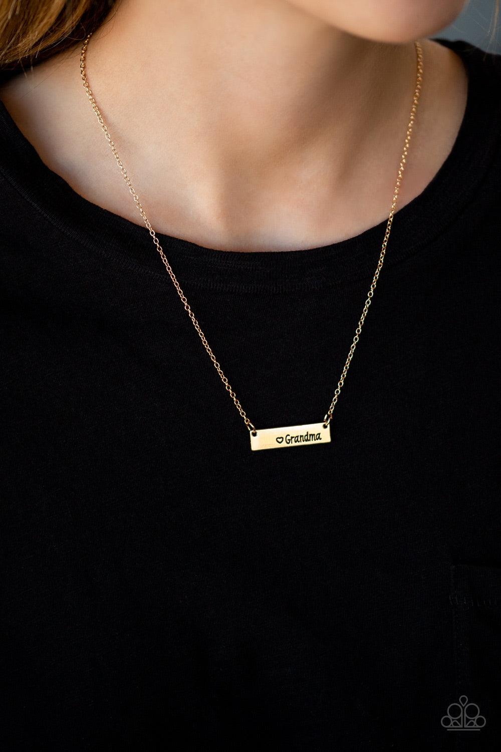 Paparazzi Accessories Best Grandma EVER - Gold A shimmery gold frame stamped with the word, "Grandma", is suspended horizontally below the collar for a sentimental fashion. Features an adjustable clasp closure. Jewelry