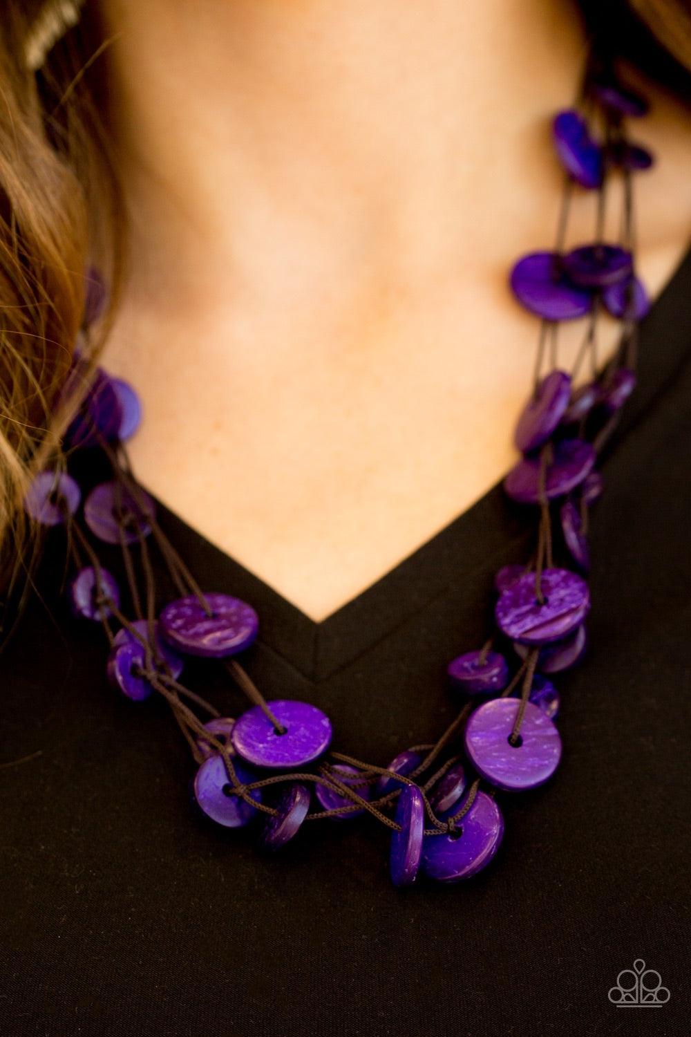 Paparazzi Accessories Bermuda Beach House - Purple Tinted in a vivacious purple finish, distressed wooden discs trickle along strands of knotted brown cording, creating colorful layers below the collar for a seasonal vibe. Features a button-loop closure.