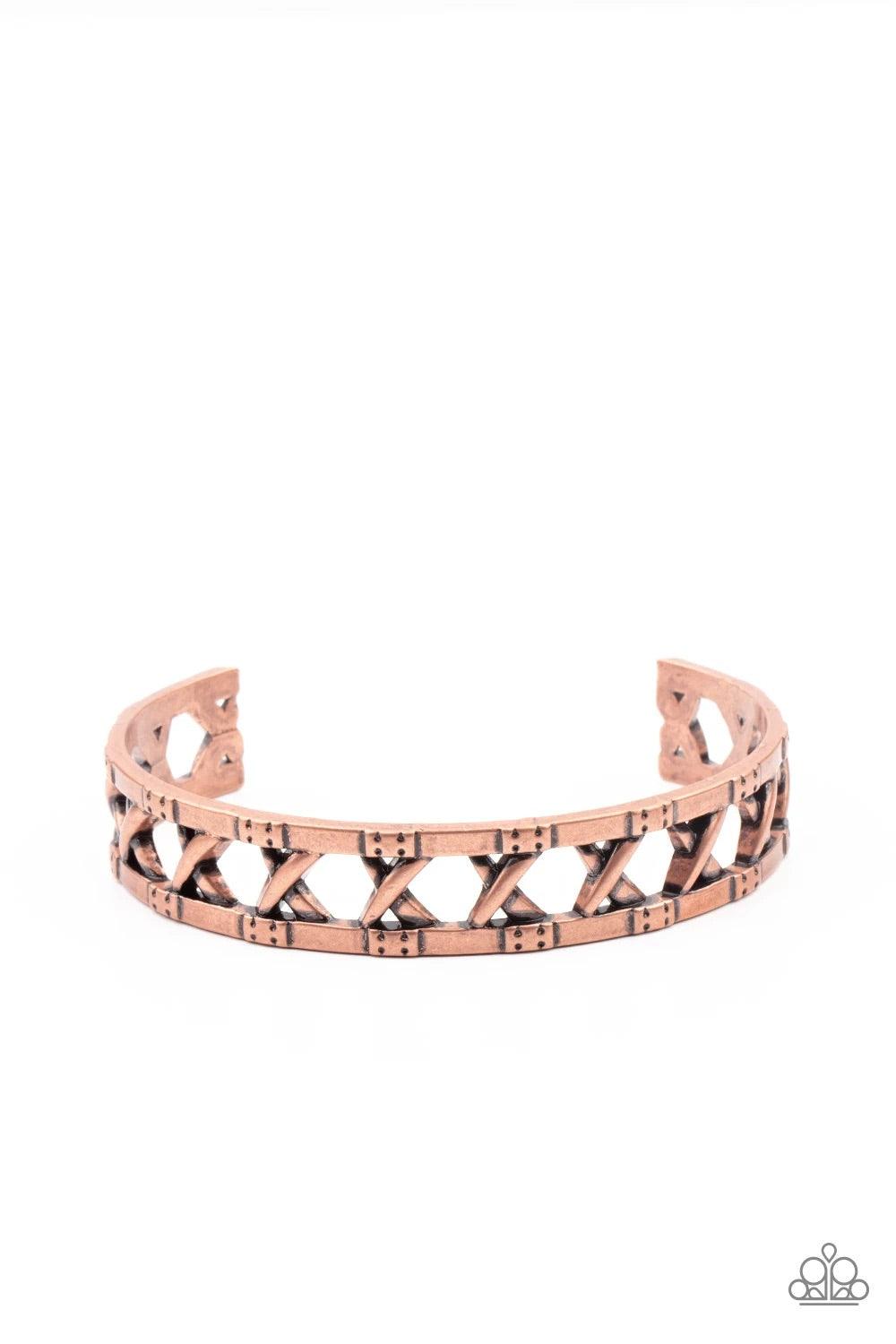 Paparazzi Accessories In Over Your METALHEAD - Copper Asymmetrical bars crisscross inside the airy center of a rustic copper cuff, creating an edgy display around the wrist. Jewelry