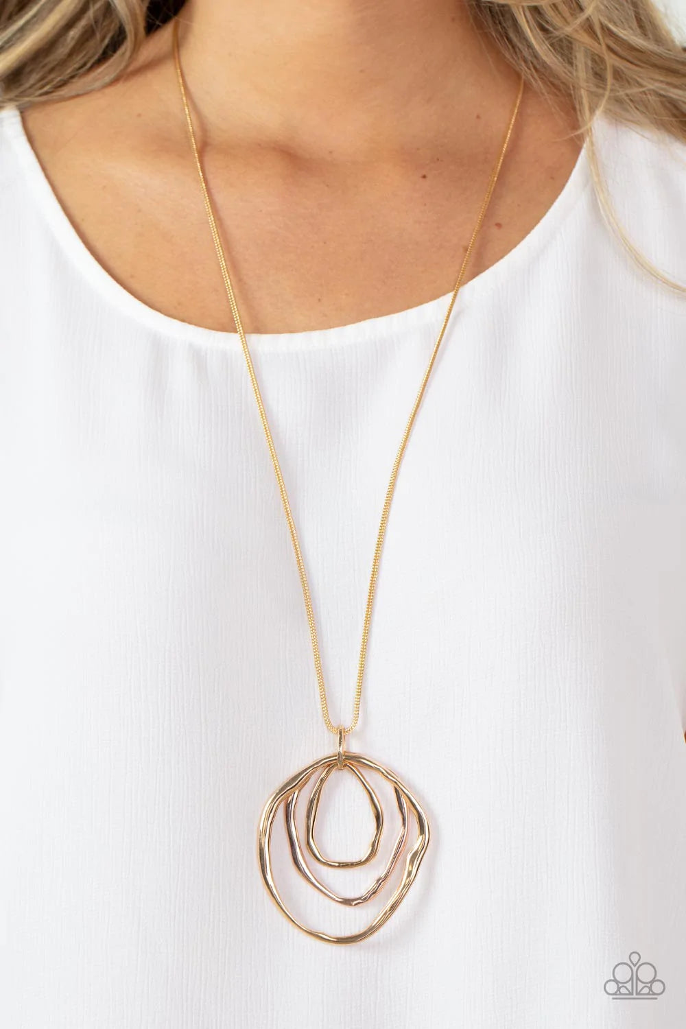 Paparazzi Accessories Revamped Relic - Gold A trio of mismatched warped gold and rose gold rings swing from the bottom of a glistening gold chain, creating an asymmetrically stacked pendant. Features an adjustable clasp closure. Sold as one individual nec