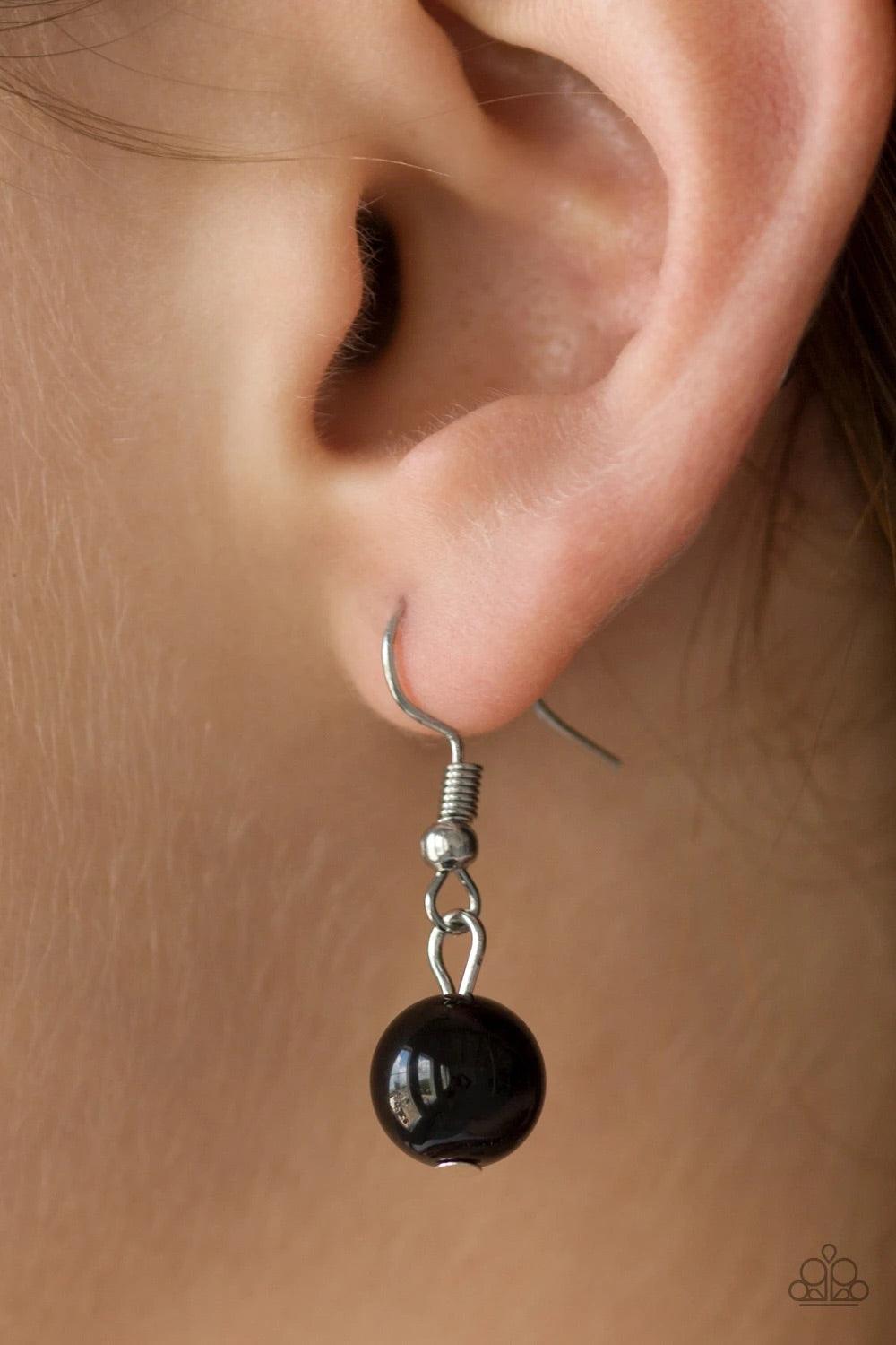 Paparazzi Accessories Flirtatiously Florida - Black Featuring round and asymmetrical shapes, shiny silver and black beads swing from the bottom of a bold silver chain, creating a flirtatious fringe below the collar. Features an adjustable clasp closure. S