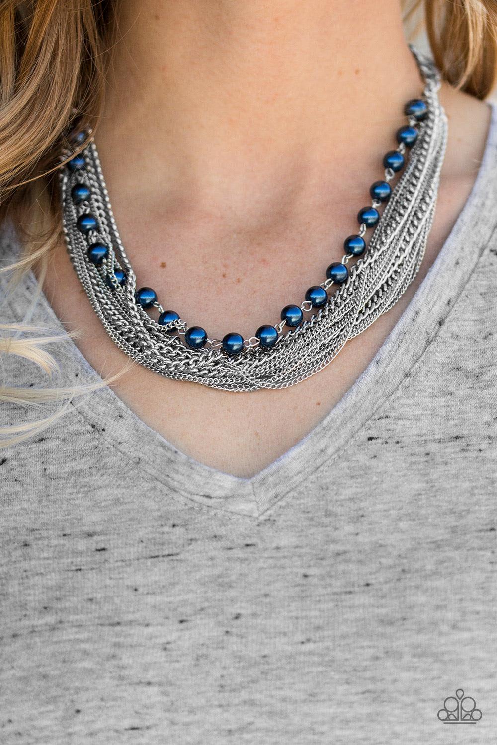 Paparazzi Accessories Fierce Fashion - Blue A strand of classic blue pearls gives way to layers of mismatched silver chain, creating a fierce look below the collar. Features an adjustable clasp closure. Sold as one individual necklace. Includes one pair o