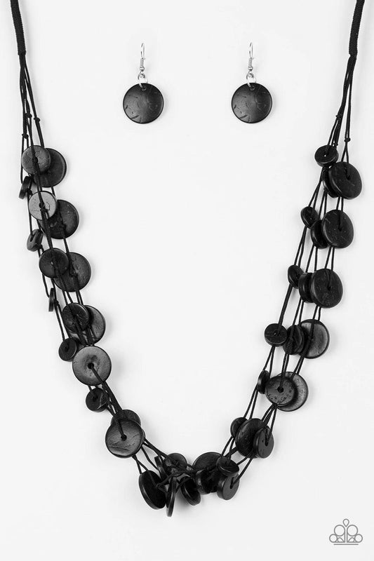 Paparazzi Accessories Bermuda Beach House - Black Tinted in a black finish, distressed wooden discs trickle along strands of knotted black cording, creating neutral layers below the collar for a seasonal vibe. Features a button-loop closure. Sold as one i