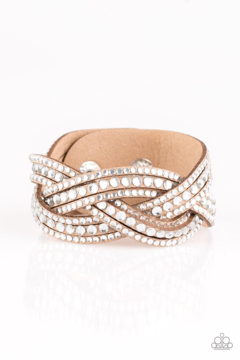 Paparazzi Accessories Bring On The Bling - Brown Varying in size, glassy white rhinestones are encrusted along interwoven brown suede bands, creating blinding shimmer across the wrist. Features an adjustable snap closure. Sold as one individual bracelet.