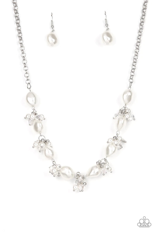 Paparazzi Accessories Rolling with the BRUNCHES - White An oval brown cat's eye gemstone sits atop a pronged silver frame along two layered silver bands, resulting in an enchanting centerpiece atop the finger. Features a stretchy band for a flexible fit.