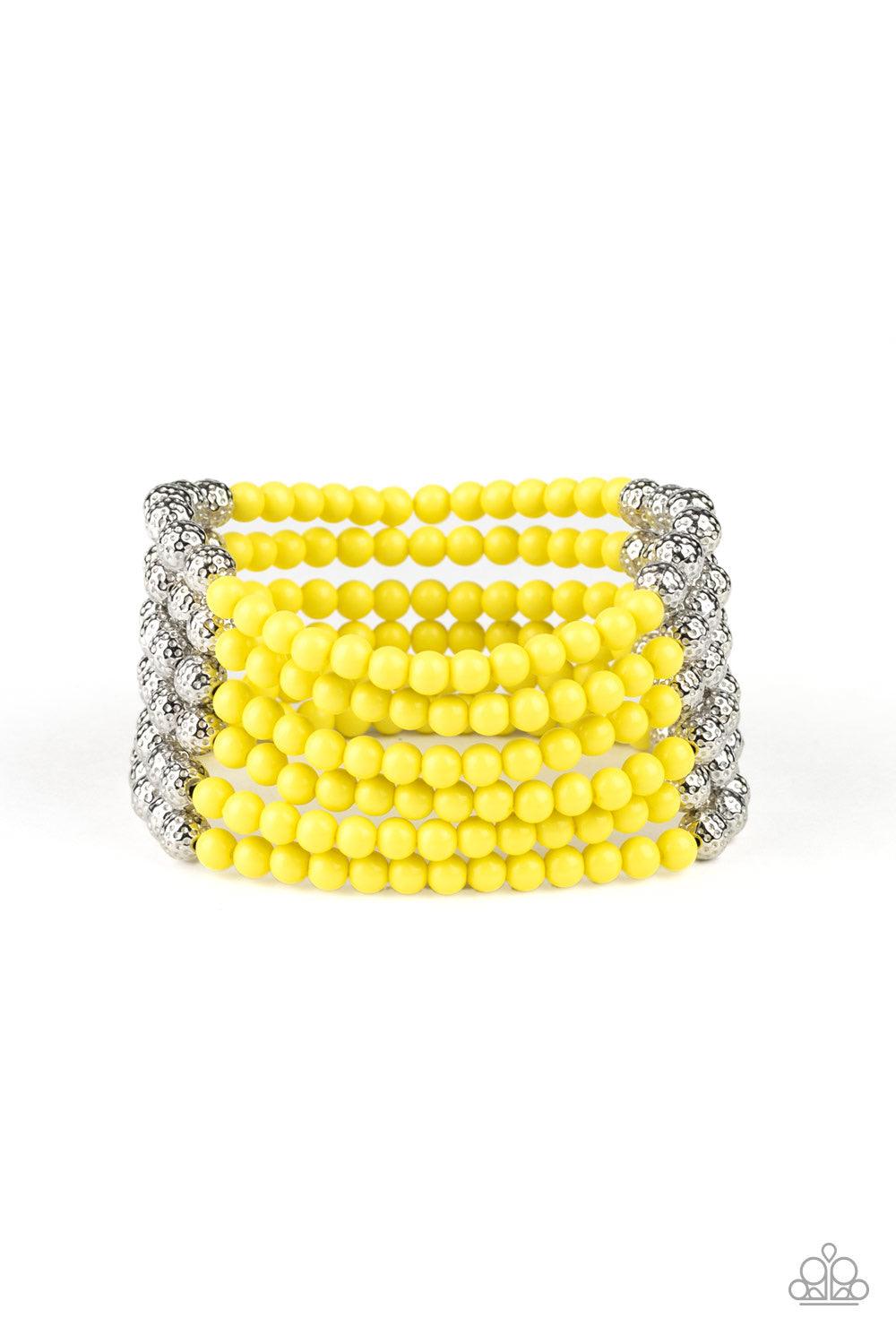 Paparazzi Accessories LAYER It on Thick - Yellow Held together with silver fittings, row after row of ornate silver and polished yellow beads are threaded along stretchy bands around the wrist for a colorful fashion. Jewelry