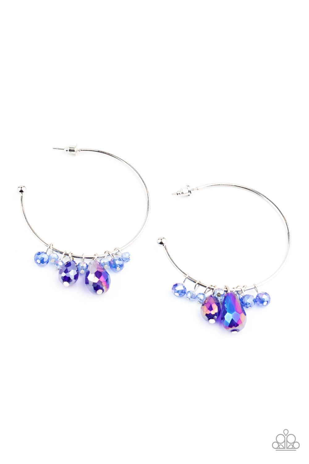 Paparazzi Accessories Dazzling Downpour - Blue Featuring an iridescent shimmer, a collection of round and teardrop crystal-like beads slide along a dainty silver hoop for a modern twist. Earring attaches to a standard post fitting. Hoop measures approxima