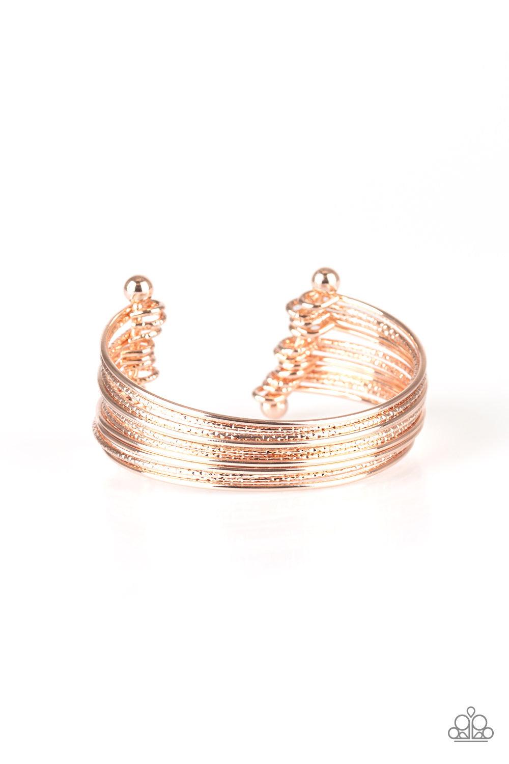 Paparazzi Accessories Endlessly Empress - Gold Attached to two rose gold rods, smooth and textured rose gold bars curl around the wrist, creating the illusion of stacked bangles. Sold as one individual bracelet. Jewelry