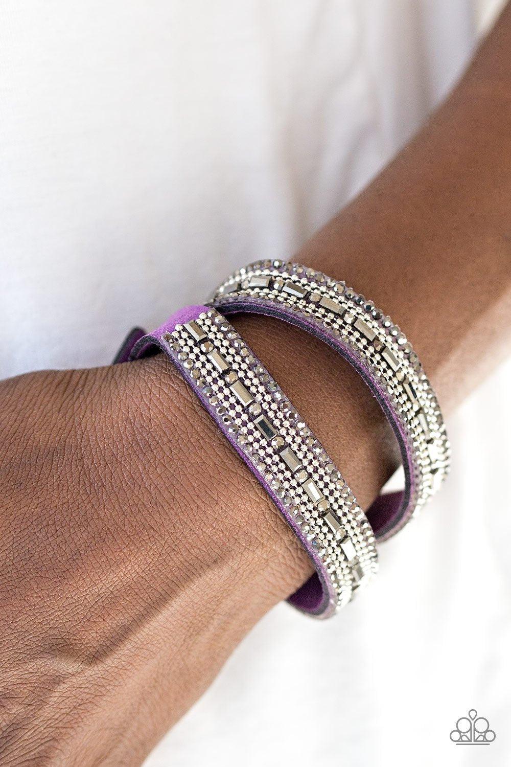 Paparazzi Accessories Shimmer And Sass - Purple Featuring round and emerald style cuts, glassy hematite rhinestones are encrusted along a purple suede band. Rows of shimmery silver ball-chain are pressed into the glittery band for a sassy finish. The elon