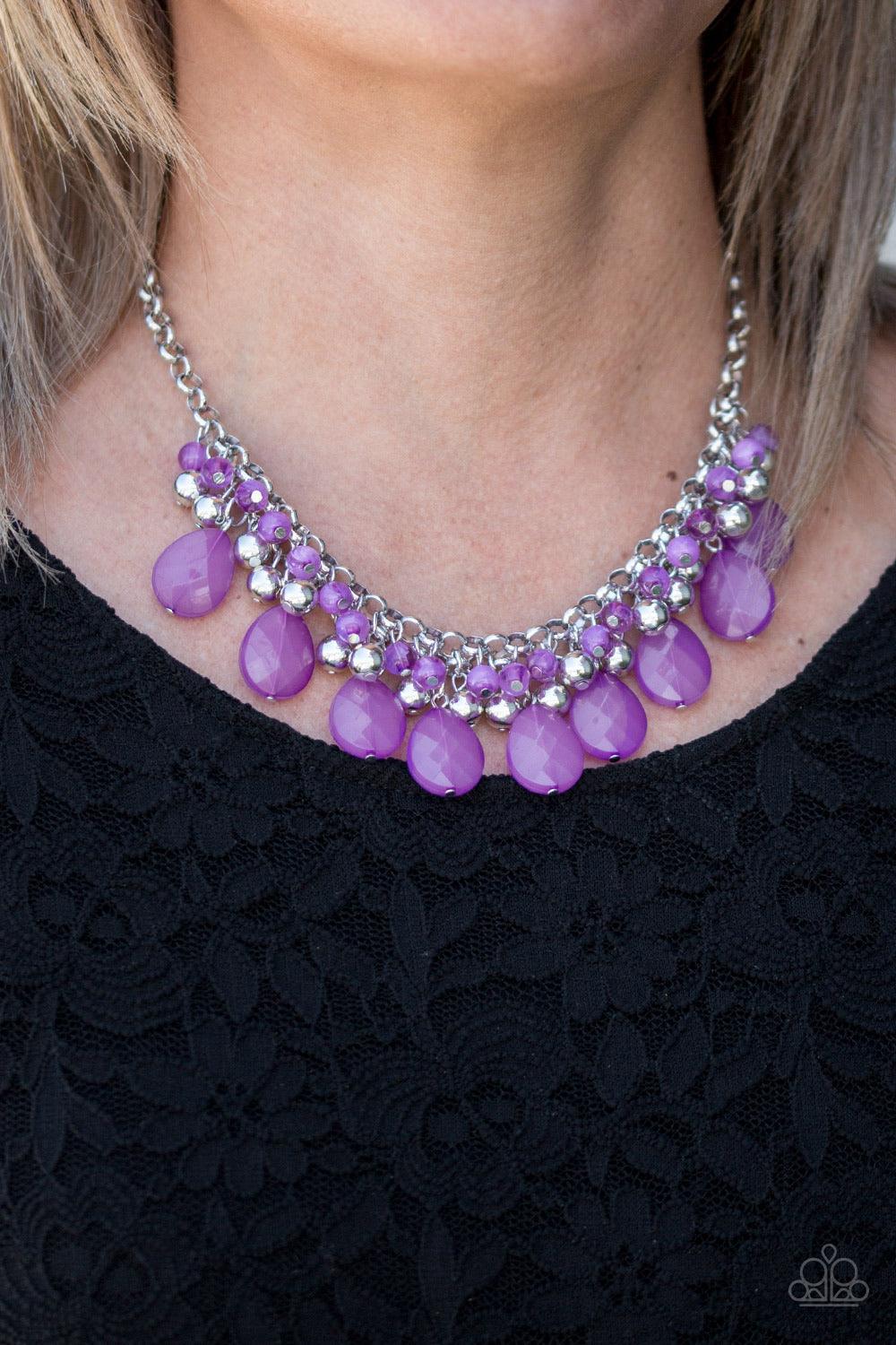 Paparazzi Accessories Trending Tropicana ~Purple A row of cloudy purple beads gives way to a row of shiny silver beads. Brushed in an opalescent finish, purple teardrops cascade from the bottom of bold interlocking silver chains, creating a dramatically c