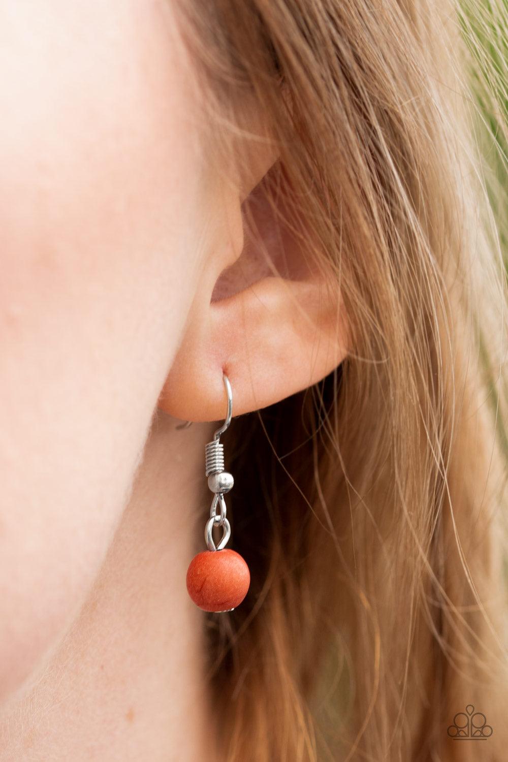 Paparazzi Accessories Run Out Of RODEO - Orange A vivacious orange stone is pressed into the center of a shimmery silver frame radiating with sunburst details. The earthy frame swings from the bottom of a lengthened silver chain for a seasonal finish. Fea