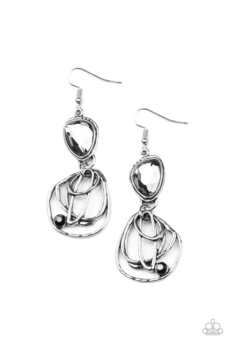 Paparazzi Accessories Galactic Drama - Black Encased in a stacked silver frame, an asymmetrical smoky gem gives way to a dizzyingly abstract silver frame dotted with a single hematite rhinestone for an edgy finish. Earring attaches to a standard fishhook