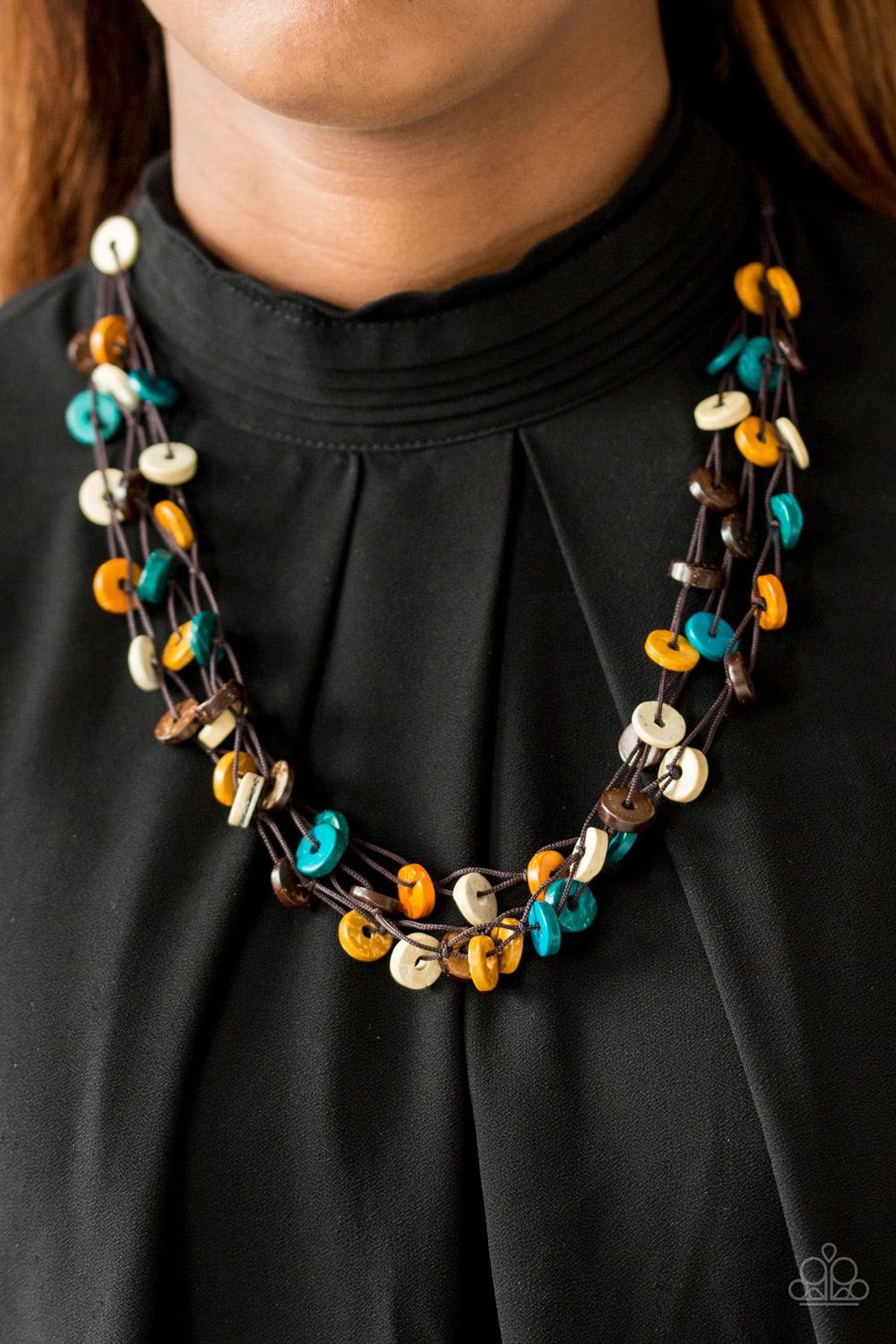 Paparazzi Accessories Hoppin Honolulu - Multi Tinted in multicolored finishes, distressed wooden discs trickle along strands of knotted brown cording, creating colorful layers below the collar for a seasonal vibe. Features a button-loop closure. Jewelry