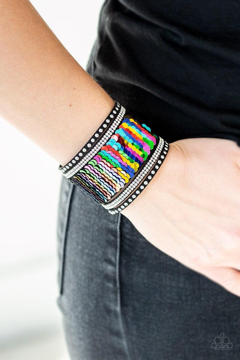 Paparazzi Accessories MERMAIDS Have More Fun - Multi Shiny silver studs, glassy white rhinestones, and shimmering sequins are sprinkled across a thick black suede band that has been spliced into five glittery rows. Bracelet features reversible sequins tha