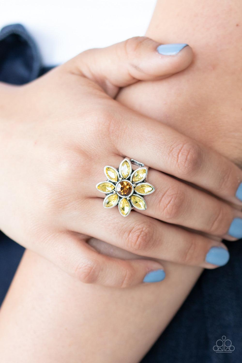 Paparazzi Accessories Prismatic Petals - Yellow Golden yellow rhinestone petals bloom from the center of a topaz rhinestone center, creating a sparkling flower atop the finger. Features a stretchy band for a flexible fit. Sold as one individual ring. Jewe