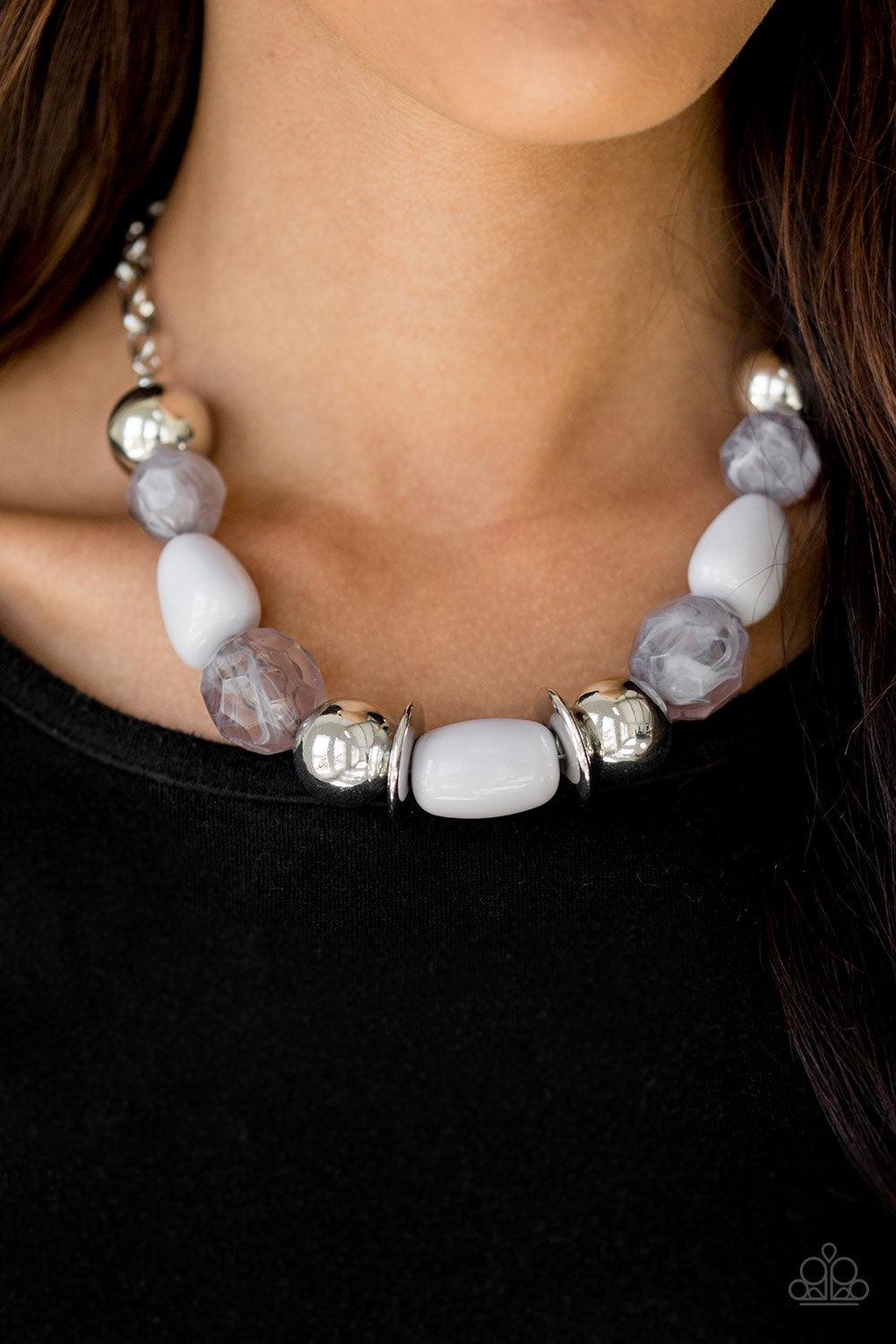 Paparazzi Accessories South Shore Sensation - Silver Dramatic silver, neutral gray, and faceted cloudy beads are threaded along an invisible wire below the collar for a seasonal look. Features an adjustable clasp closure. Jewelry