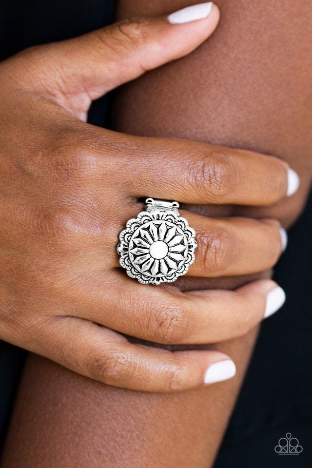 Paparazzi Accessories Daringly Daisy - White A polished white bead is pressed into a glistening silver frame radiating into a floral detail for a seasonal look. Features a stretchy band for a flexible fit. Sold as one individual ring. Jewelry