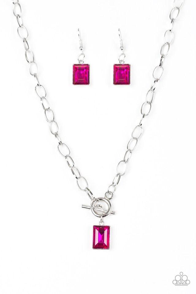 Paparazzi Accessories Wear It Like You Mean It! - Pink Featuring a regal emerald-style cut, a glassy pink rhinestone is pressed into a sleek silver frame. The glittery frame swings from the bottom of a bold silver chain, creating a glamorous pendant below